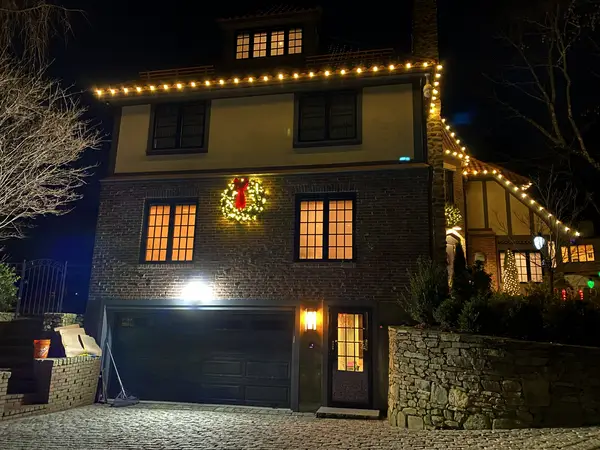 Roofline and landscape lighting on a home in Brookline, MA