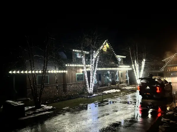 Roofline and landscape lighting on a home in Carroll, NH