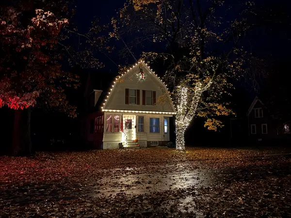 Roofline and landscape lighting on a home in Claremont, NH