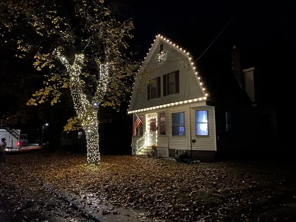 Roofline and landscape lighting on a home in Claremont, NH
