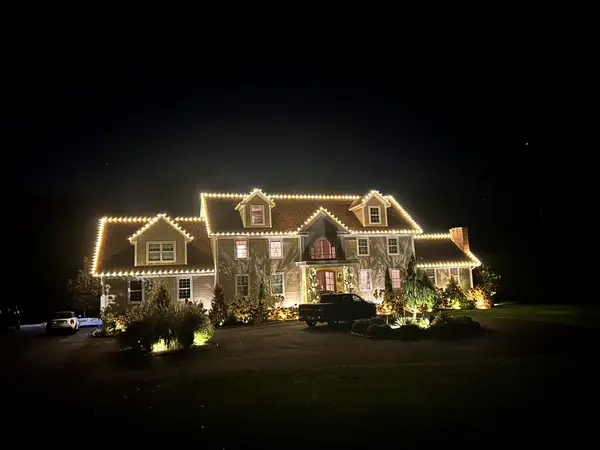 Roofline and landscape lighting on a home in Killingworth, CT