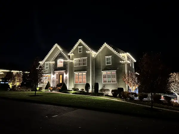 Roofline and landscape lighting on a home in Middleton, MA