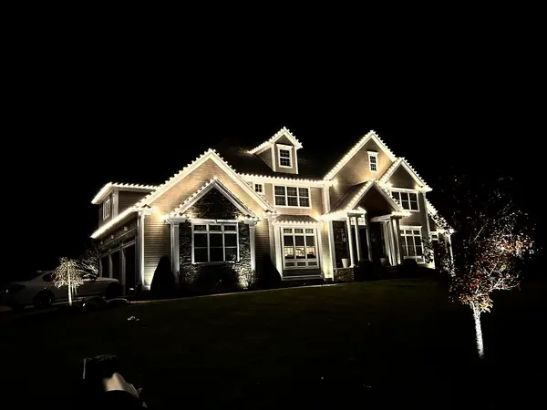 Roofline and landscape lighting on a home in Middleton, MA