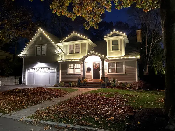 Roofline and landscape lighting on a home in Newton, MA