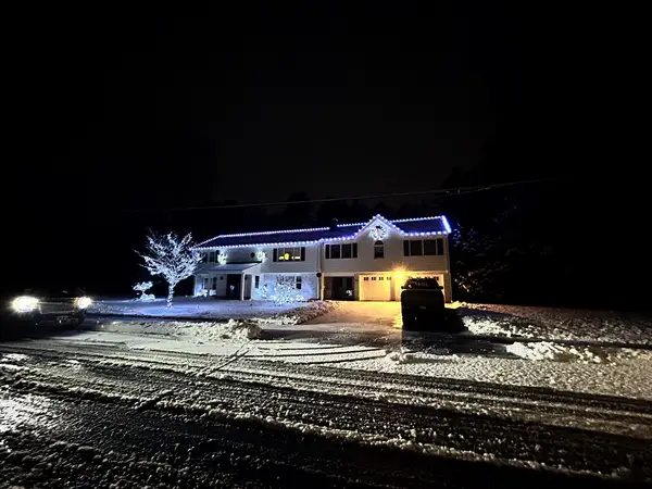 Roofline and landscape lighting on a home in North Reading, MA