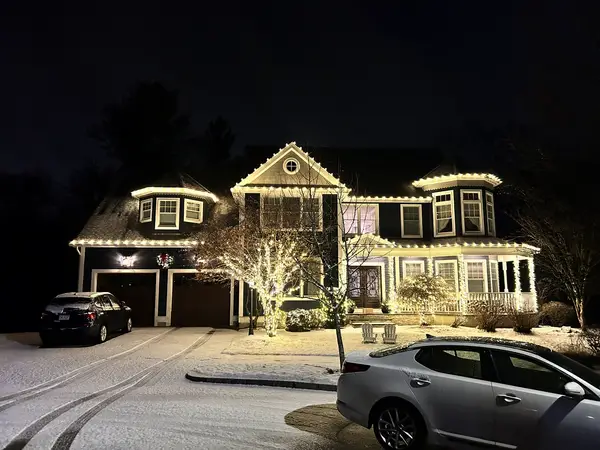 Roofline and landscape lighting on a home in Reading, MA