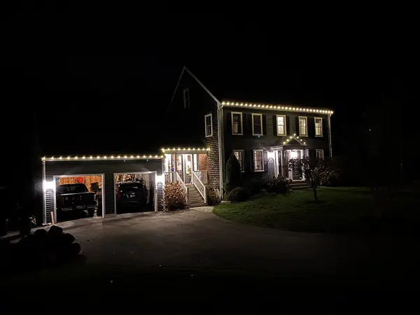 Roofline and landscape lighting on a home in Scituate, MA
