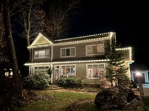 Roofline and landscape lighting on a home in Shrewsbury, MA