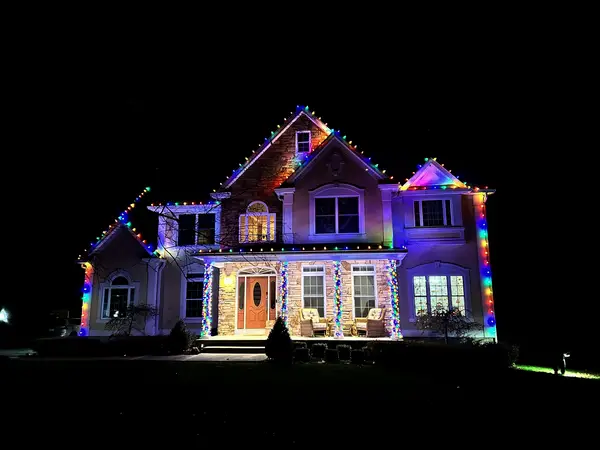 Warm white roofline lighting on a home in Town of Fishkill, NY