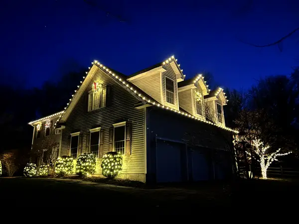 Roofline and landscape lighting on a home in Town of Red Hook, NY