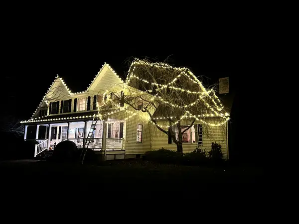 Warm white roofline lighting on a home in Union, NJ