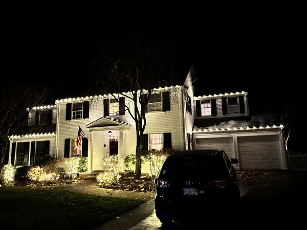 Roofline and landscape lighting on a home in Wellesley, MA