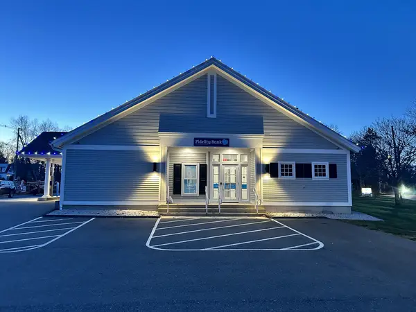 Commercial holiday lighting on a retail storefront in Winchendon, MA