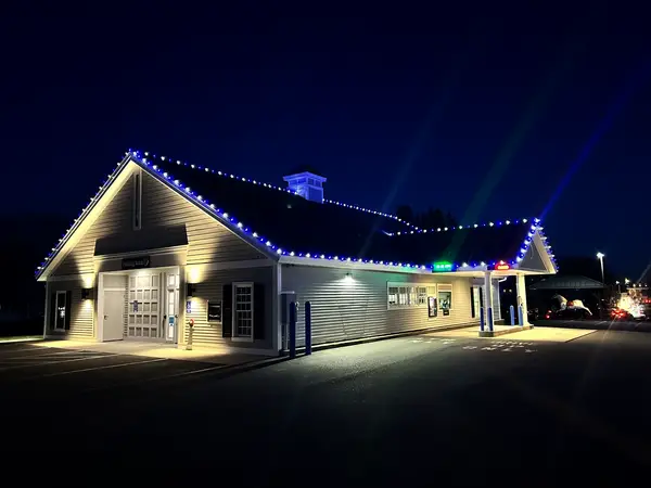 Commercial holiday lighting on a retail storefront in Winchendon, MA