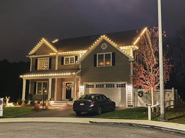 Roofline and landscape lighting on a home in Woburn, MA