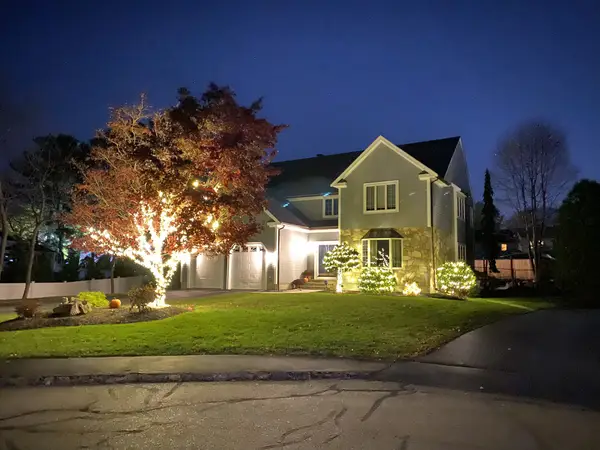 Roofline, bushes and walkway lit in Woburn, MA