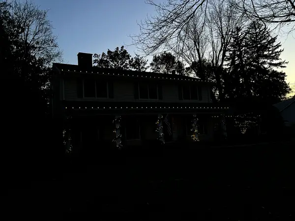 Warm white roofline lighting on a home in Wyckoff, NJ