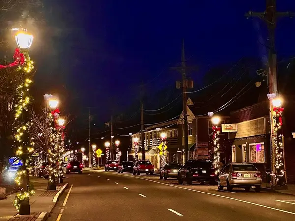 Municipal holiday lighting on a town center building installed by the Holiday Lights Decor network