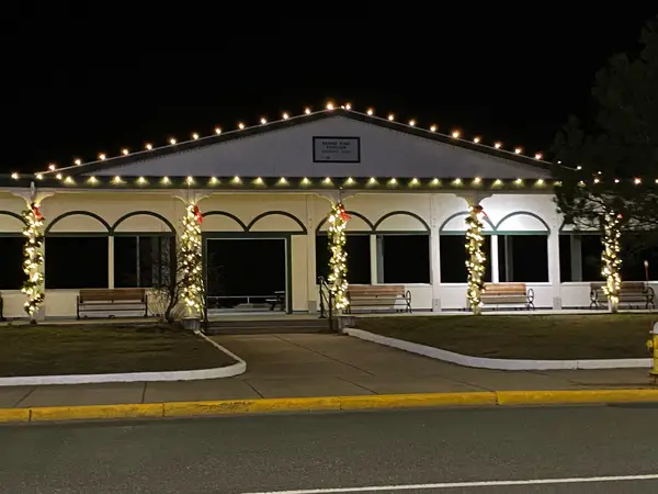 Municipal holiday lighting on a town center building installed by the Holiday Lights Decor network