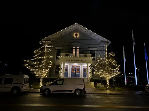 Municipal holiday lighting on a town center building installed by the Holiday Lights Decor network