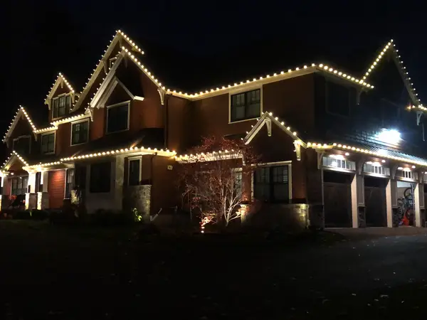 Municipal holiday lighting on a town center building installed by the Holiday Lights Decor network